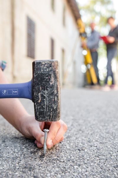 Survey crew placing a boundary marker during a residential property survey