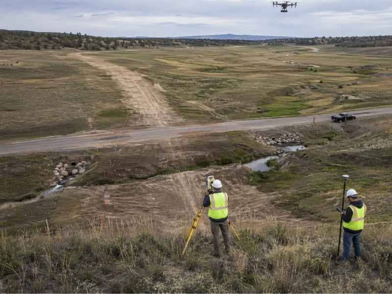 LiDAR mapping for planning utility corridors across a large site in Orlando Florida, showing surveyors, a drone survey, and terrain features affecting route alignment.
